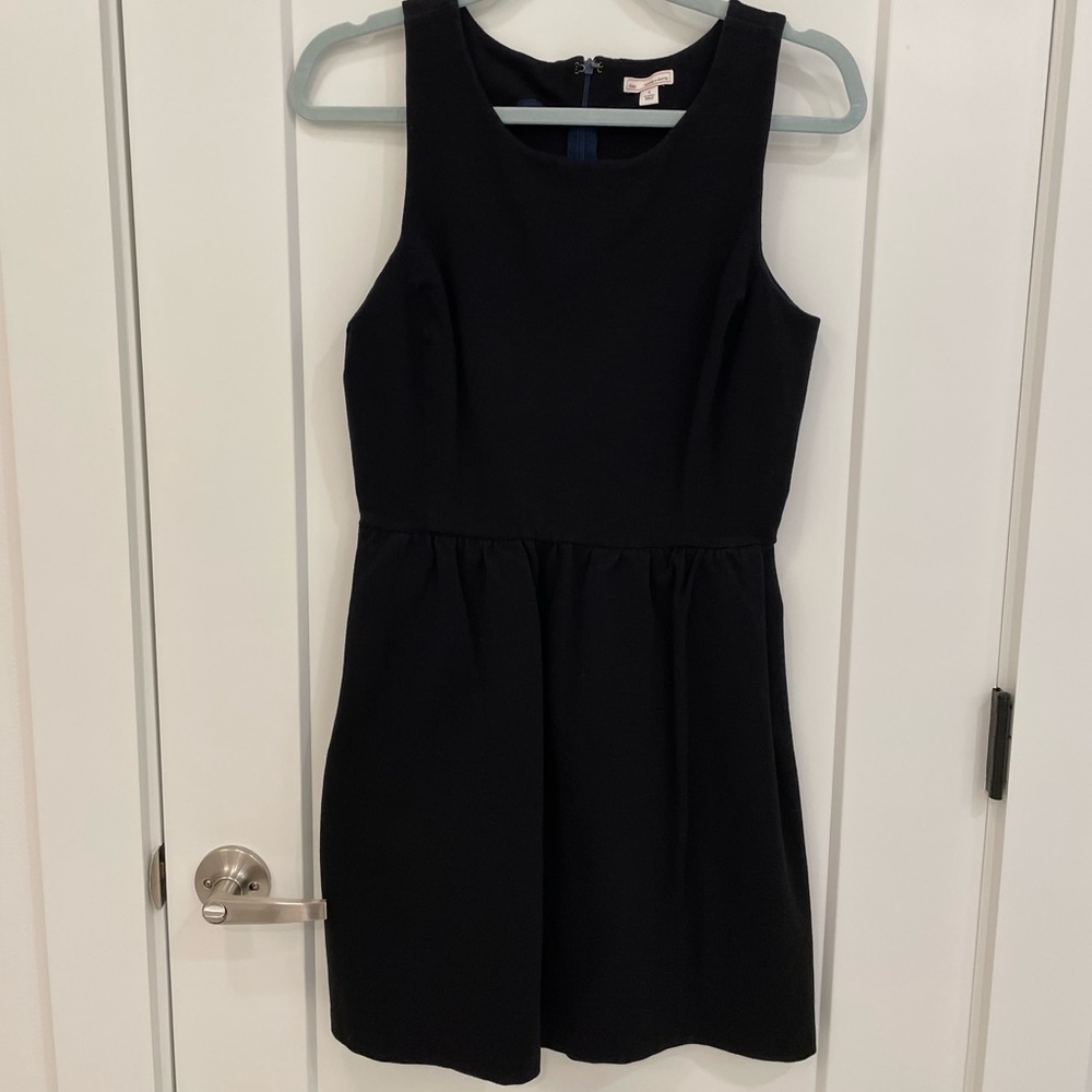 Thick black dress with cinched waist